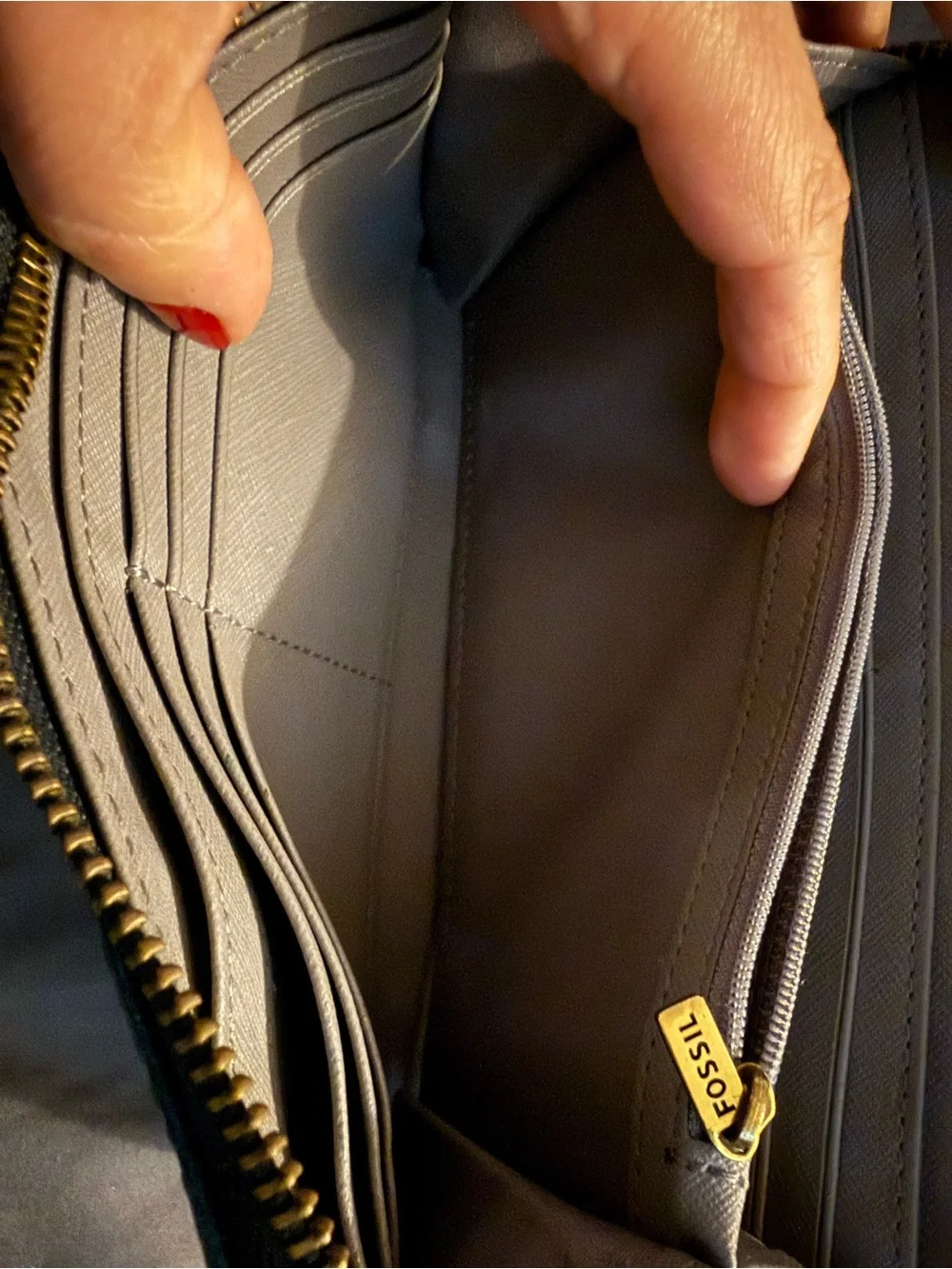 Fossil wallet and fossil wristlet clip